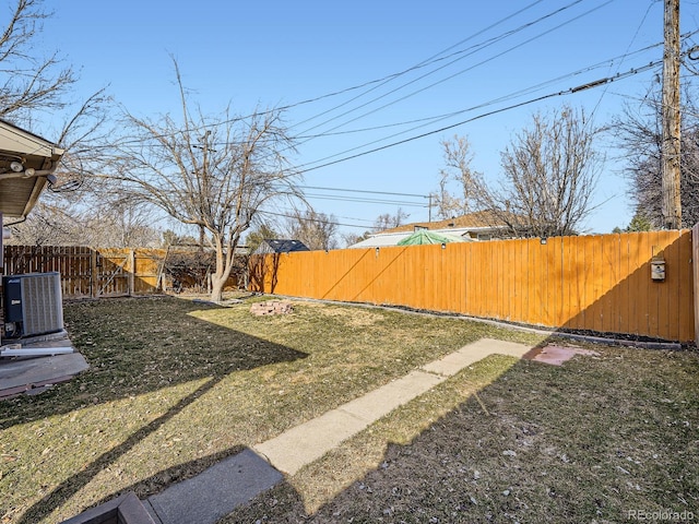 view of yard featuring cooling unit and a fenced backyard