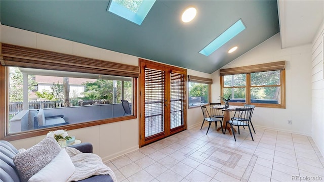 941 E 130th Cir, Thornton, CO 80241 - dining room featuring a skylight, vaulted ceiling, and light tile patterned floors