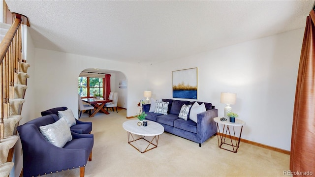941 E 130th Cir, Thornton, CO 80241 - living area with arched walkways and carpet floors