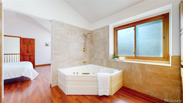 941 E 130th Cir, Thornton, CO 80241 - bathroom featuring vaulted ceiling and wood finished floors