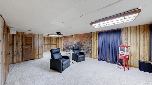 941 E 130th Cir, Thornton, CO 80241 - living area with wood walls and carpet floors