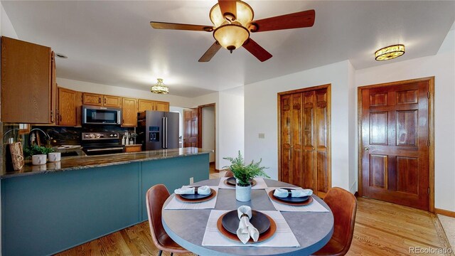 941 E 130th Cir, Thornton, CO 80241 - dining room featuring light wood-style floors and ceiling fan