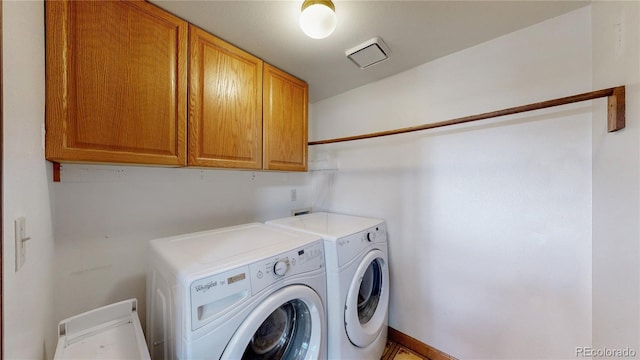 941 E 130th Cir, Thornton, CO 80241 - laundry area featuring cabinet space and washing machine and clothes dryer