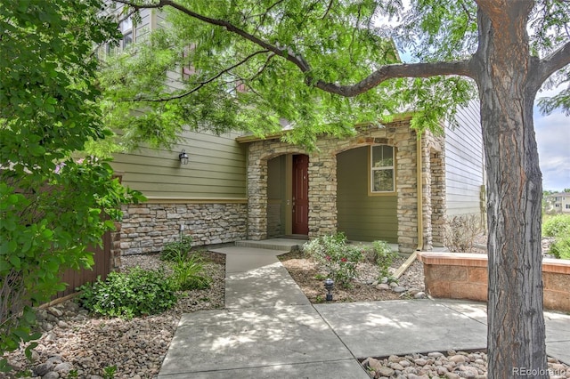 10597 Ashfield St, Highlands Ranch, CO 80126 - doorway to property with stone siding