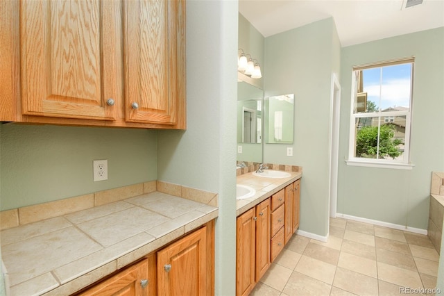 10597 Ashfield St, Highlands Ranch, CO 80126 - full bath featuring double vanity and tile patterned flooring