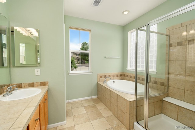 10597 Ashfield St, Highlands Ranch, CO 80126 - full bathroom featuring vanity, a stall shower, a bath, and tile patterned flooring