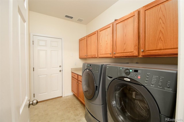 10597 Ashfield St, Highlands Ranch, CO 80126 - washroom with cabinet space, independent washer and dryer, and light floors