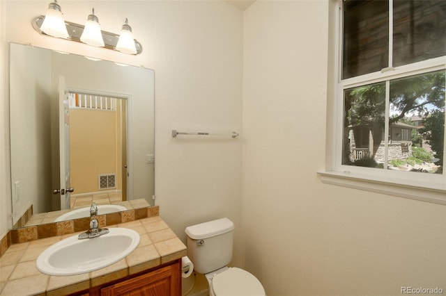 10597 Ashfield St, Highlands Ranch, CO 80126 - half bathroom featuring vanity and toilet