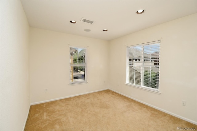 10597 Ashfield St, Highlands Ranch, CO 80126 - empty room with light carpet, plenty of natural light, and recessed lighting