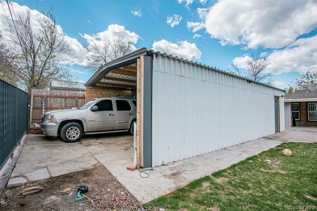view of outbuilding with fence