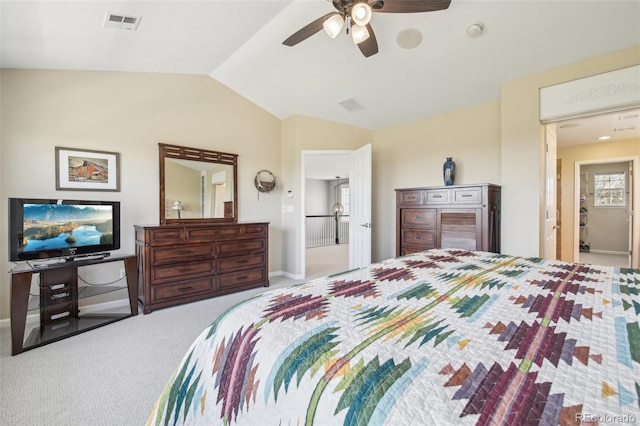 carpeted bedroom featuring vaulted ceiling, baseboards, and a ceiling fan
