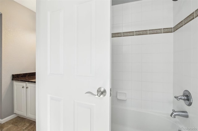 bathroom with shower / bathtub combination and vanity