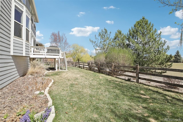 view of yard with a deck and stairway