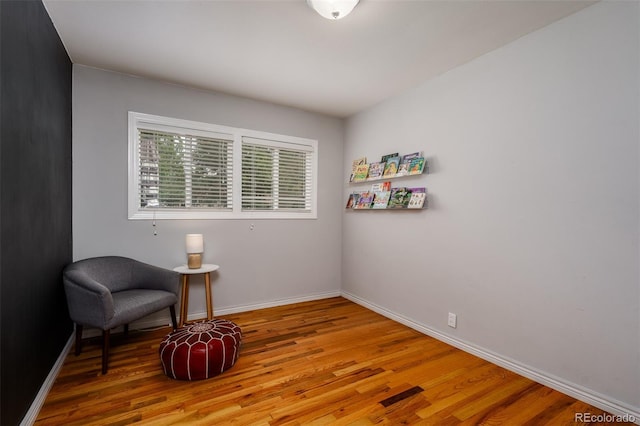 sitting room with light hardwood / wood-style flooring