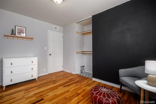 sitting room featuring light wood-type flooring