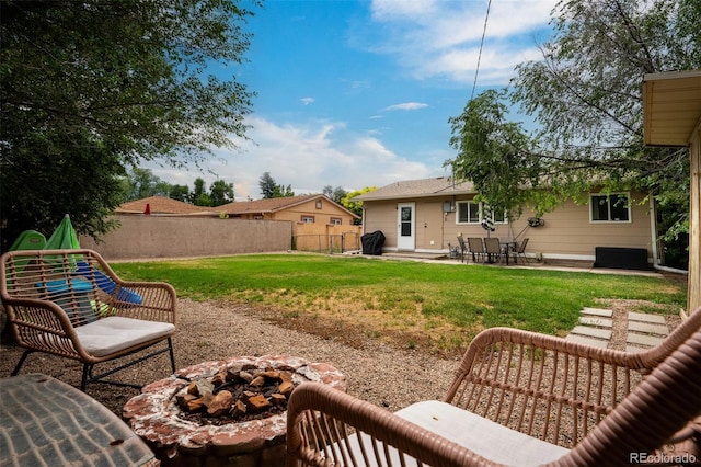 view of yard featuring a patio area and a fire pit