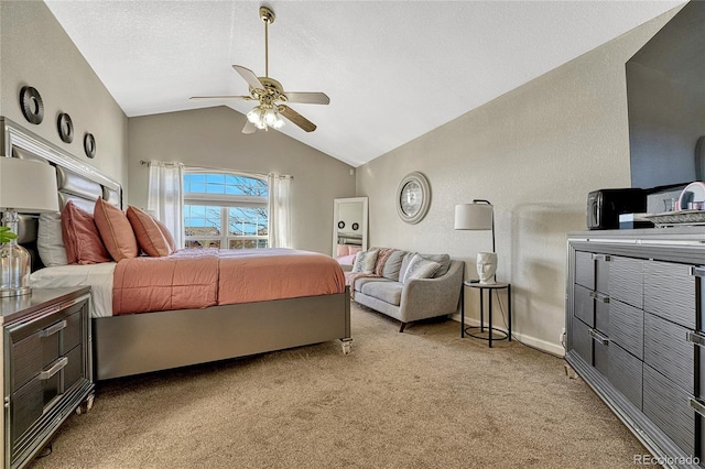 carpeted bedroom with ceiling fan, lofted ceiling, and a textured ceiling