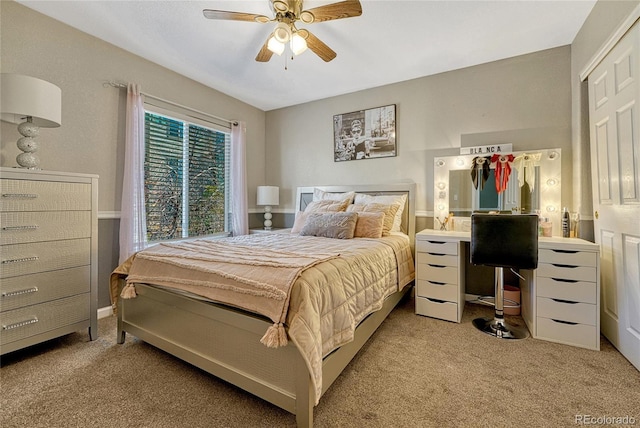 bedroom featuring ceiling fan and light colored carpet