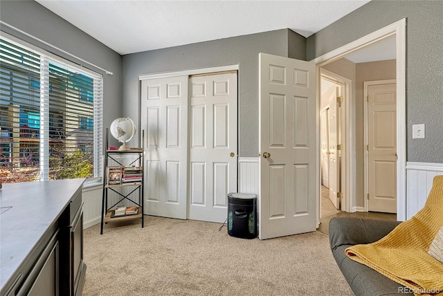 sitting room with light colored carpet