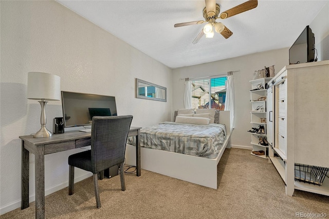 bedroom with light carpet and ceiling fan