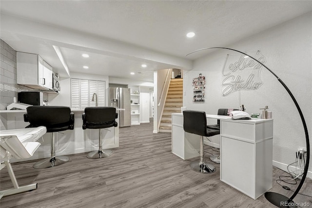 office with light hardwood / wood-style flooring