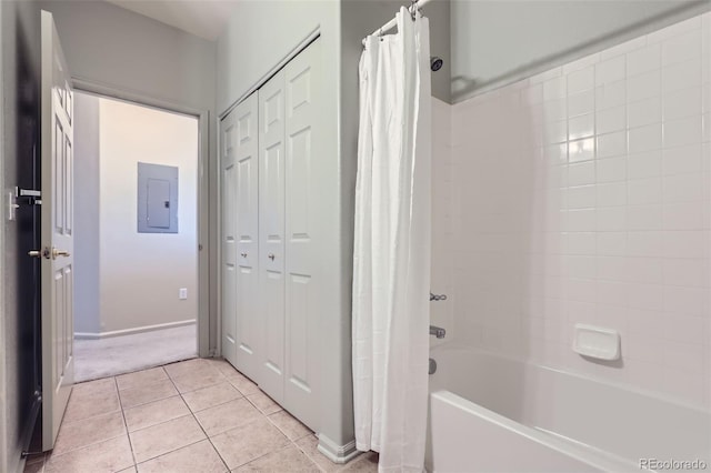 bathroom featuring shower / tub combo, tile patterned flooring, and electric panel