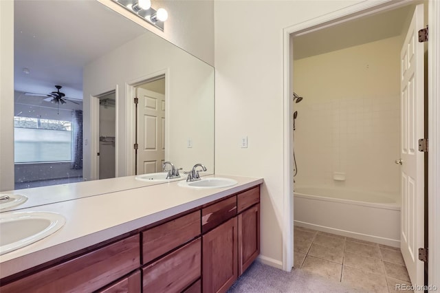 bathroom with ceiling fan, tile patterned floors, vanity, and shower / washtub combination