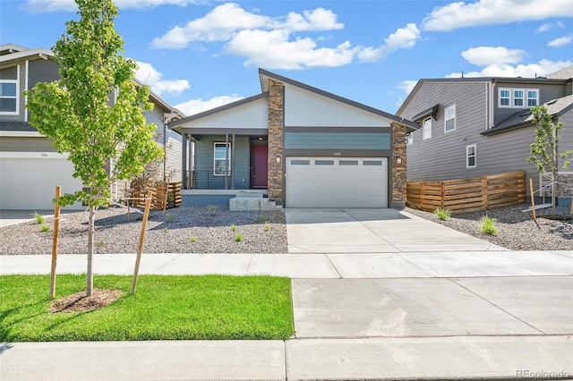 view of front of property featuring covered porch and a garage