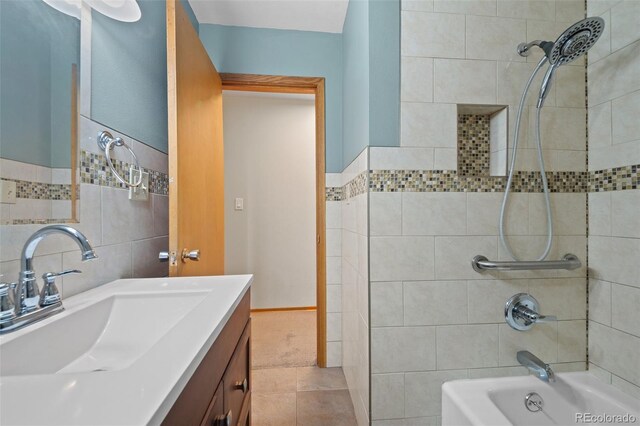 993 Fall River Rd, Idaho Springs, CO 80452 - bathroom featuring washtub / shower combination, tile patterned floors, and vanity