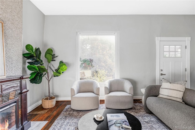 424 N Clarkson St, Denver, CO 80218 - living area featuring wood finished floors, a tile fireplace, and baseboards