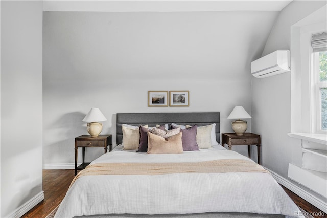 424 N Clarkson St, Denver, CO 80218 - bedroom with a wall mounted air conditioner, dark wood-type flooring, lofted ceiling, and baseboards