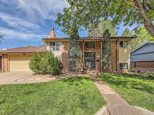 6160 Taft Ct, Arvada, CO 80004 - view of front of house with an attached garage, a chimney, brick siding, a front lawn, and driveway