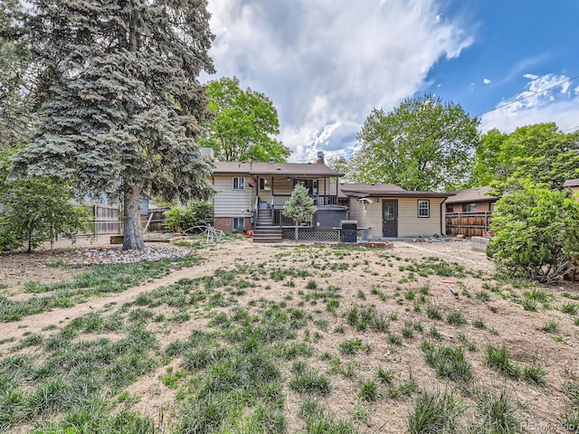 6160 Taft Ct, Arvada, CO 80004 - rear view of house featuring a fenced backyard and a wooden deck