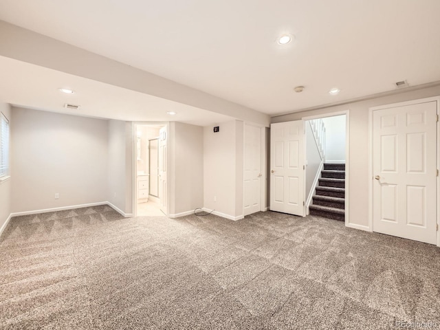 finished basement with stairs, carpet, baseboards, and recessed lighting