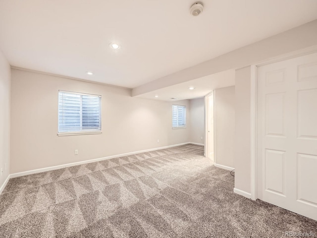 basement featuring recessed lighting, baseboards, and carpet floors