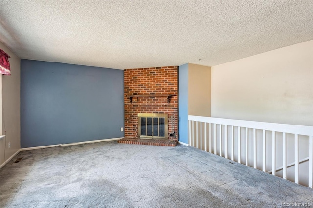 800 Park View Pl, Castle Rock, CO 80104 - unfurnished living room with carpet, a textured ceiling, baseboards, and a fireplace