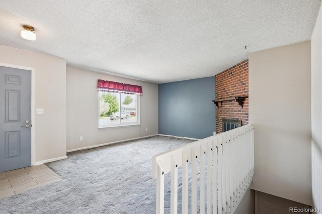 800 Park View Pl, Castle Rock, CO 80104 - entryway with a textured ceiling, carpet floors, a fireplace, and baseboards