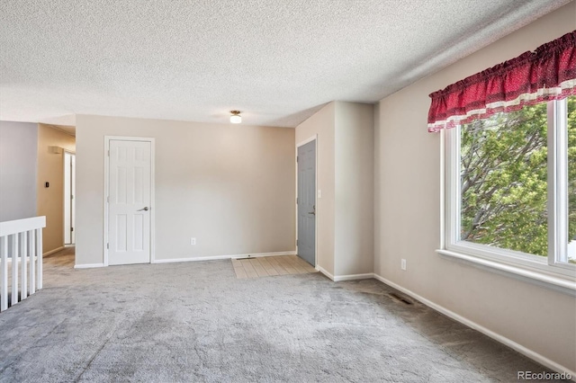 800 Park View Pl, Castle Rock, CO 80104 - spare room with carpet, a textured ceiling, and baseboards