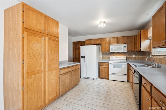 800 Park View Pl, Castle Rock, CO 80104 - kitchen featuring white appliances, a sink, backsplash, light countertops, and brown cabinets