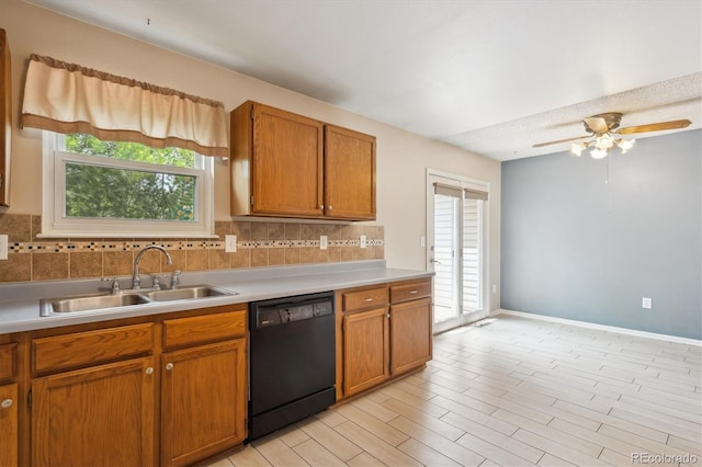 800 Park View Pl, Castle Rock, CO 80104 - kitchen featuring dishwasher, a sink, light countertops, tasteful backsplash, and brown cabinets