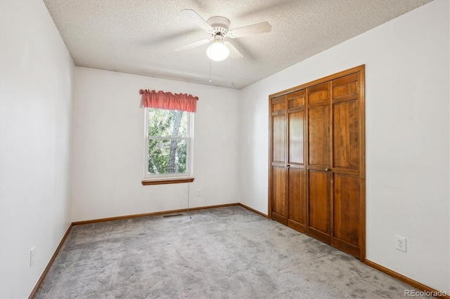 800 Park View Pl, Castle Rock, CO 80104 - unfurnished bedroom featuring a textured ceiling, carpet, baseboards, a ceiling fan, and a closet