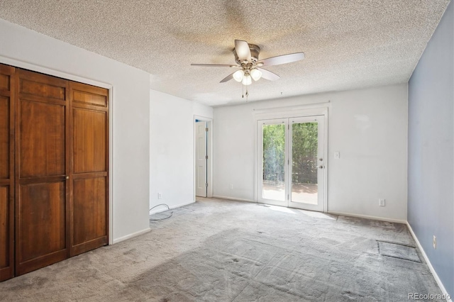 800 Park View Pl, Castle Rock, CO 80104 - unfurnished bedroom with access to exterior, carpet flooring, a textured ceiling, a ceiling fan, and baseboards