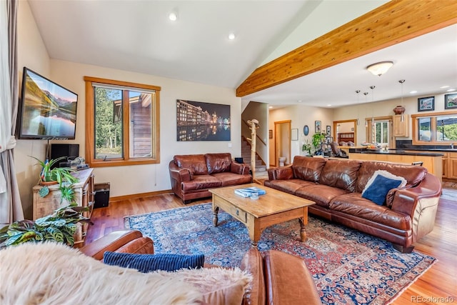 228 Glacier Ridge Rd, Alma, CO 80420 - living room with recessed lighting, light wood-style floors, vaulted ceiling, and stairway