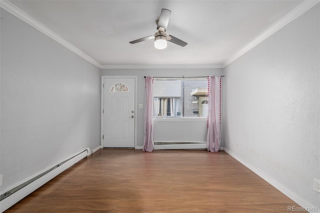 entrance foyer with a baseboard heating unit, crown molding, ceiling fan, and hardwood / wood-style flooring