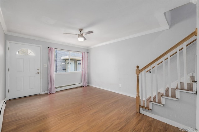 entrance foyer featuring crown molding, a baseboard radiator, and light wood-type flooring