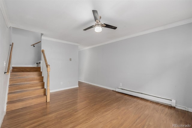 interior space with hardwood / wood-style flooring, a baseboard radiator, ornamental molding, and ceiling fan