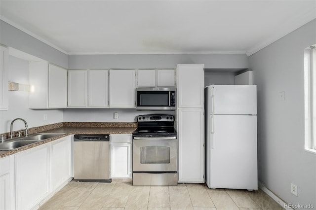 kitchen featuring sink, crown molding, white cabinets, and appliances with stainless steel finishes