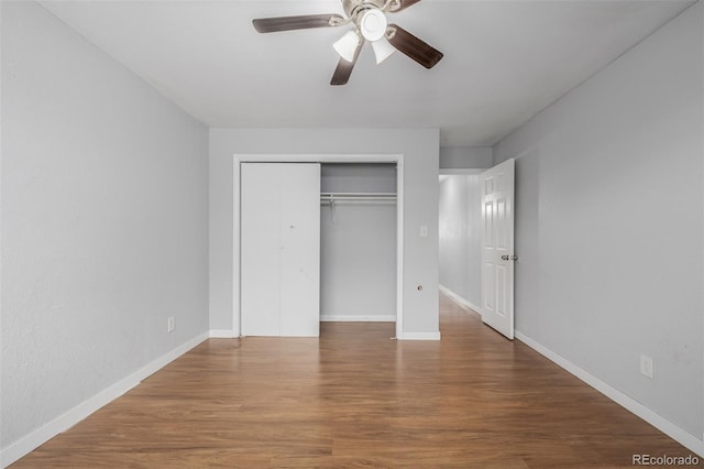 unfurnished bedroom with hardwood / wood-style floors, ceiling fan, and a closet