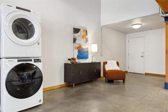 washroom with stacked washer and dryer