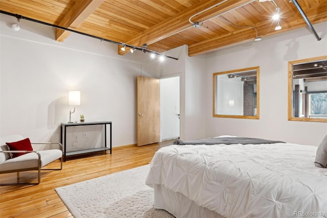 bedroom with wood ceiling, track lighting, beamed ceiling, and wood-type flooring